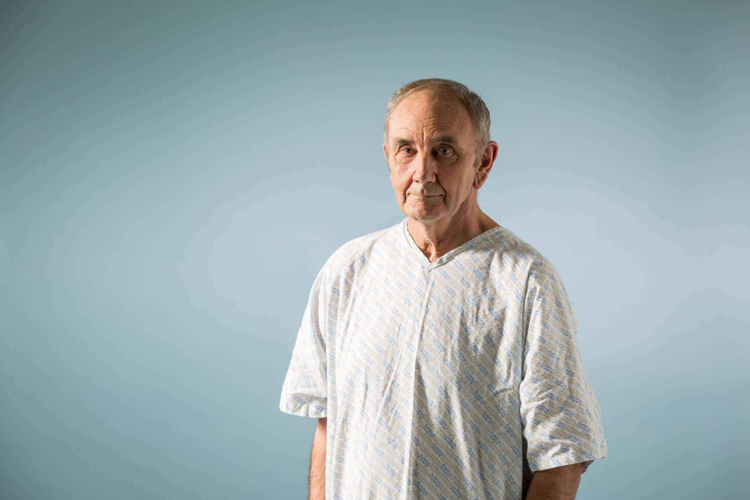 Maia brand photography of a Man in a hospital gown
