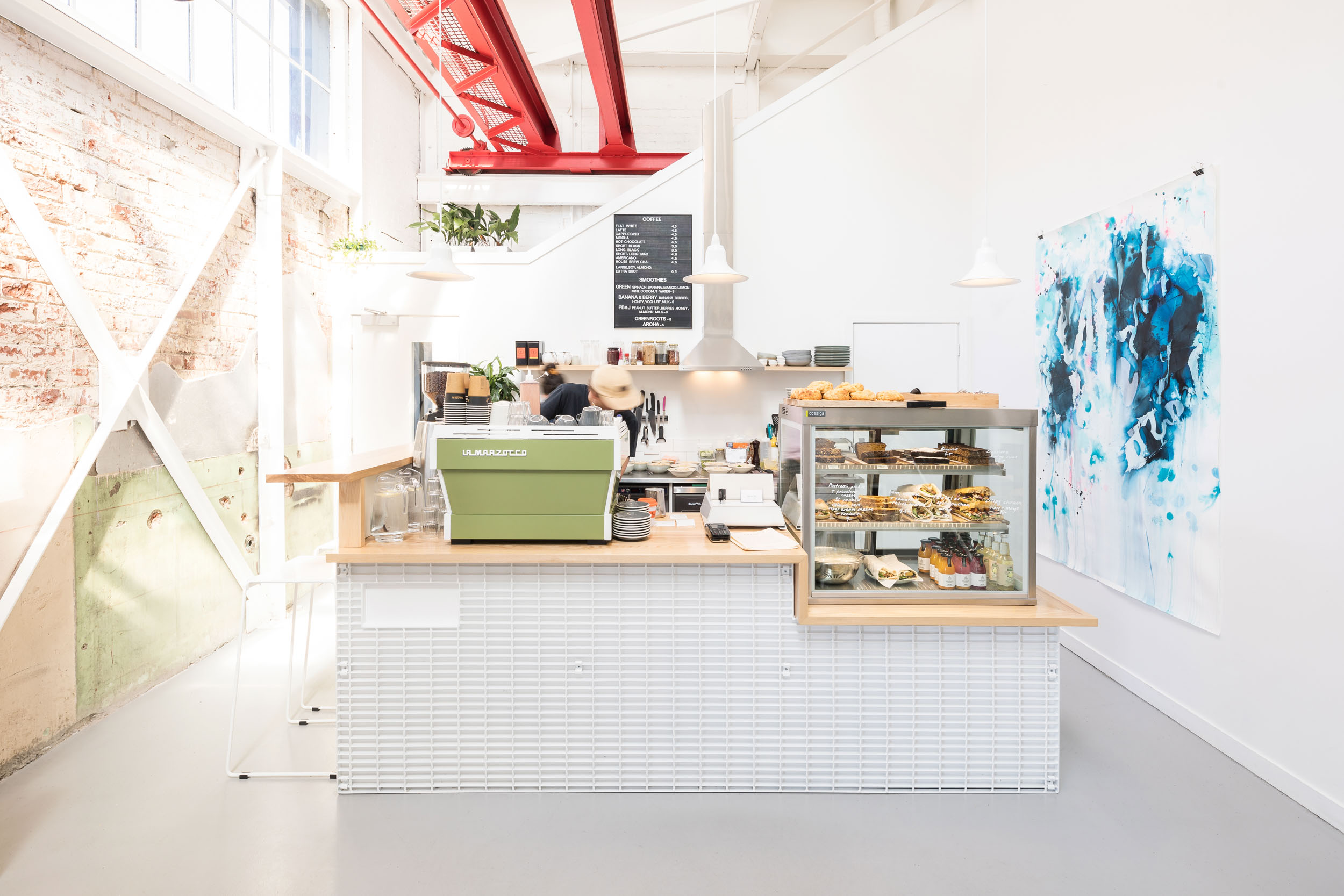 Architecturally designed cafe advertising Qb curated workspaces